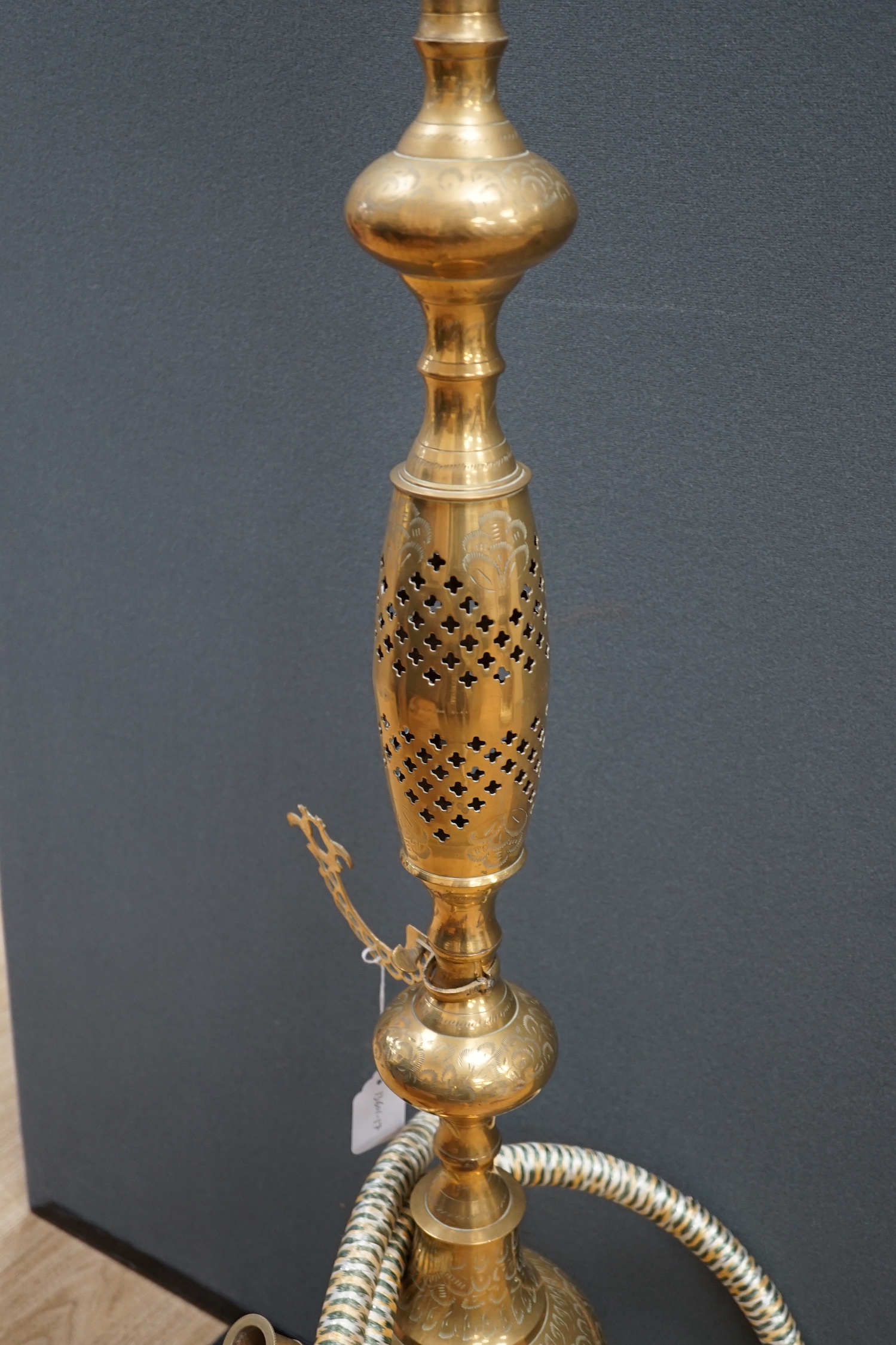 A large Middle Eastern brass hookah, 154cm